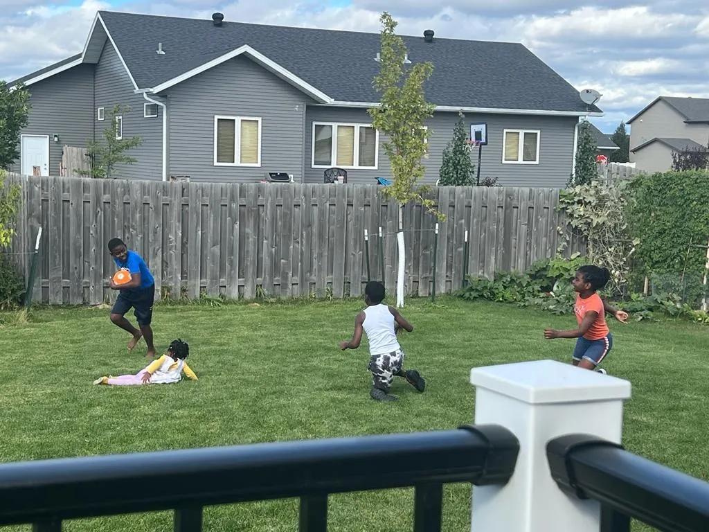 Children playing together in a backyard